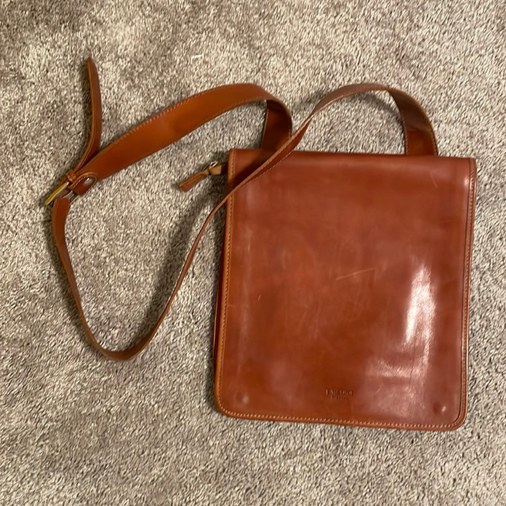 Large brown leather cross body satchel.